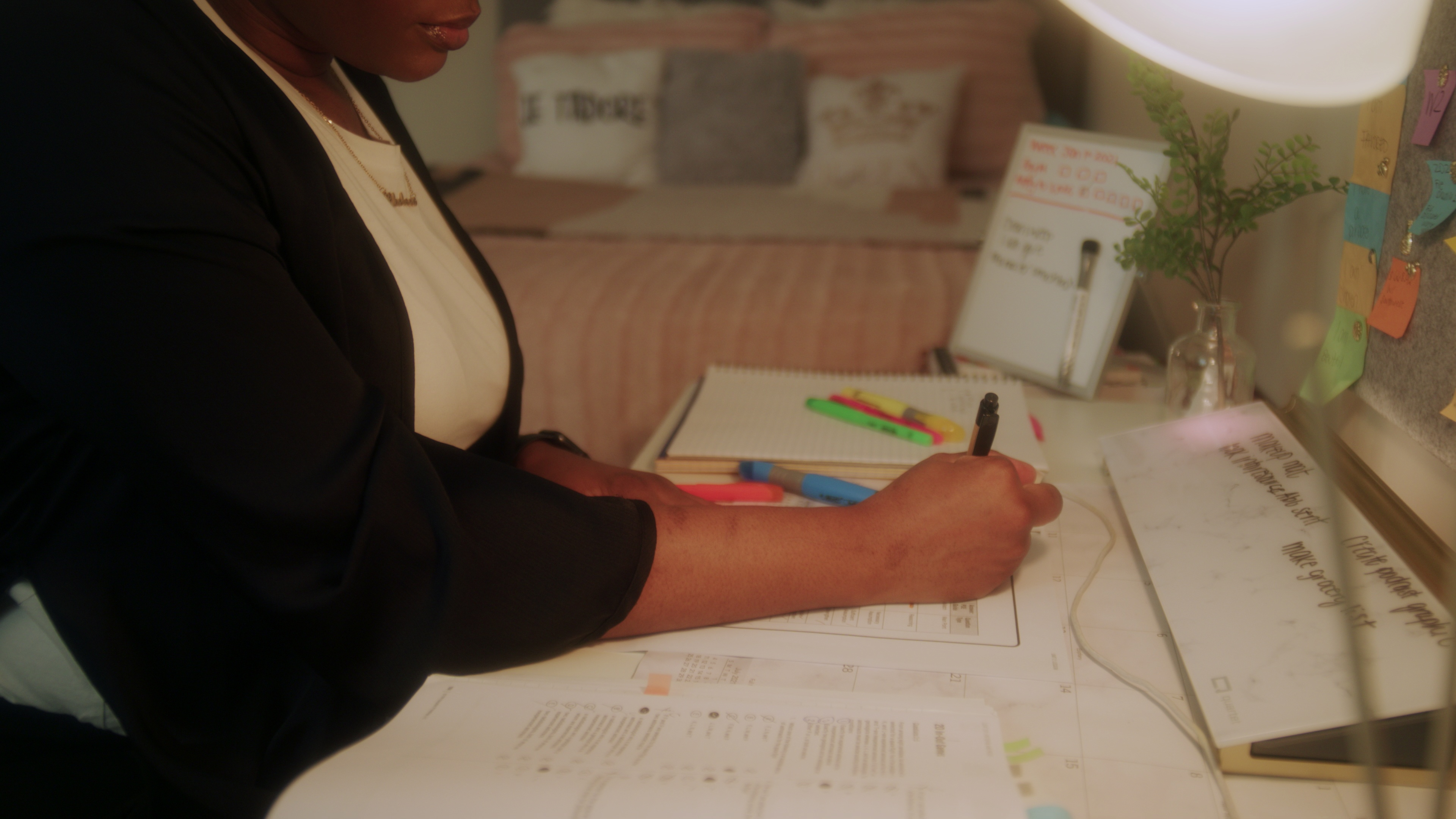 Person reviewing information on their phone and laptop before voting